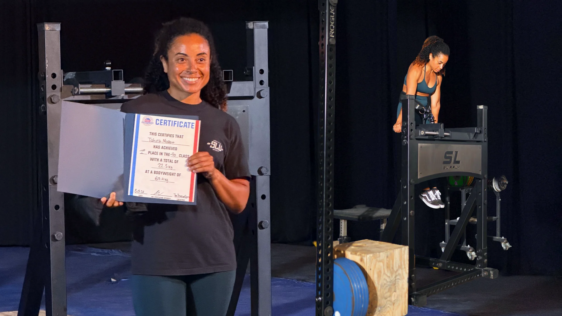 Tahirih performs a weighted dip on a Streetlifting Supply Dip Bar.